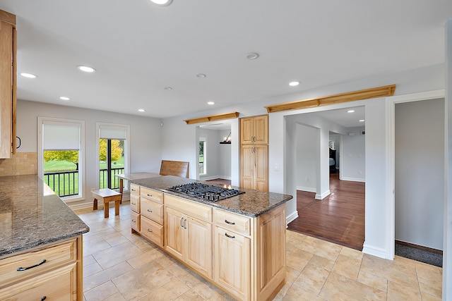 4700 Raap Rd, Bruce, MI 48065 - kitchen with gas stovetop, dark stone counters, decorative backsplash, recessed lighting, and light brown cabinets