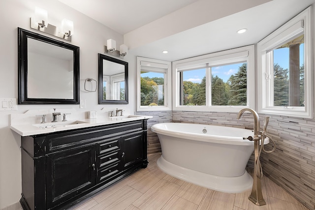 4700 Raap Rd, Bruce, MI 48065 - bathroom featuring a freestanding tub and double vanity