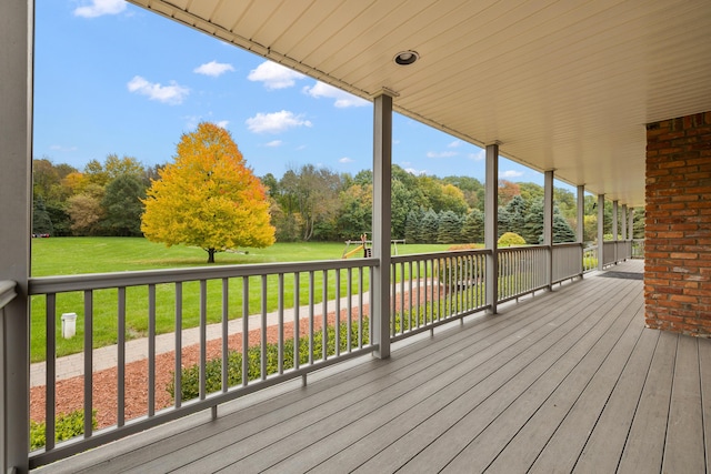 4700 Raap Rd, Bruce, MI 48065 - wooden deck featuring a yard and view of wooded area