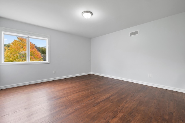 4700 Raap Rd, Bruce, MI 48065 - empty room featuring baseboards and dark wood-style flooring