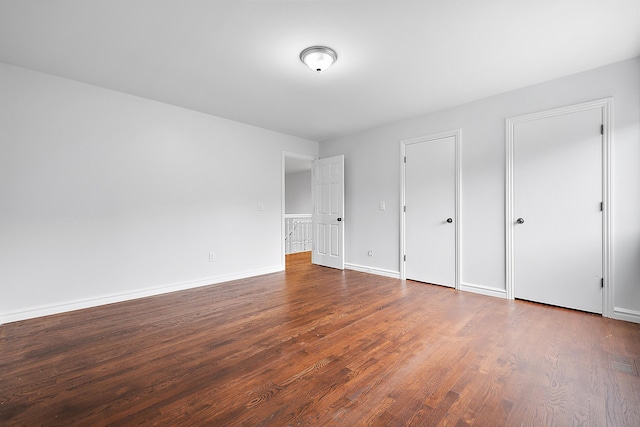 4700 Raap Rd, Bruce, MI 48065 - unfurnished bedroom featuring wood finished floors and baseboards