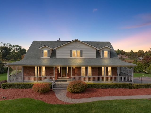 4700 Raap Rd, Bruce, MI 48065 - country-style home featuring brick siding, a porch, and roof with shingles