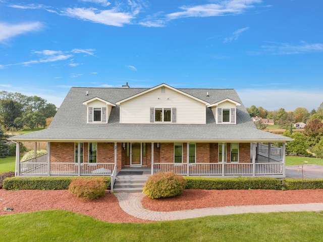 4700 Raap Rd, Bruce, MI 48065 - farmhouse inspired home featuring brick siding, covered porch, and roof with shingles