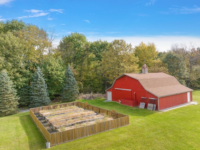 4700 Raap Rd, Bruce, MI 48065 - view of grassy yard with a barn, a garden, an outbuilding, a garage, and a view of trees