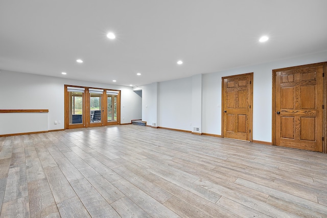 4700 Raap Rd, Bruce, MI 48065 - unfurnished living room with recessed lighting and light wood-style floors