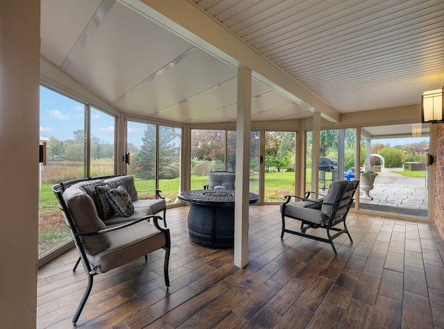 4700 Raap Rd, Bruce, MI 48065 - sunroom / solarium featuring healthy amount of natural light and an outdoor living space with a fire pit