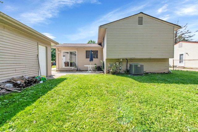 632 John Rolfe Dr, Monroe, MI 48162 - rear view of house with a lawn and a patio