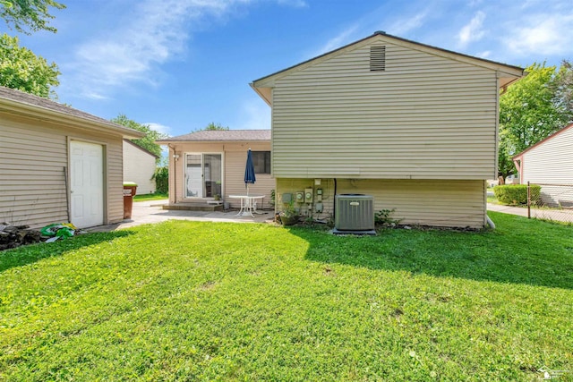 632 John Rolfe Dr, Monroe, MI 48162 - rear view of property featuring a lawn and a patio area