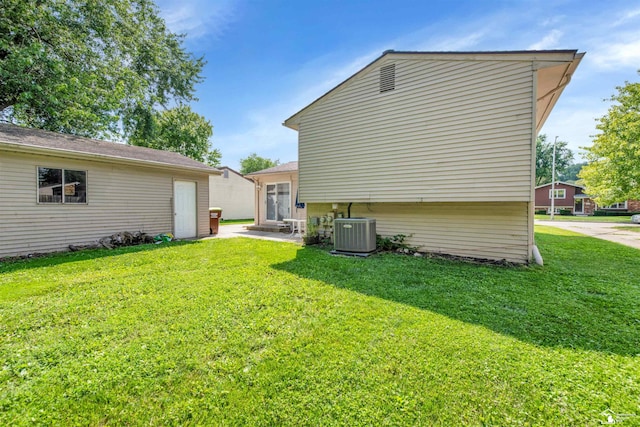 632 John Rolfe Dr, Monroe, MI 48162 - view of home's exterior with a lawn and a patio