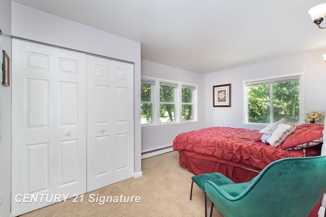 7320 N River Rd, Freeland, MI 48623 - carpeted bedroom with baseboard heating and a closet