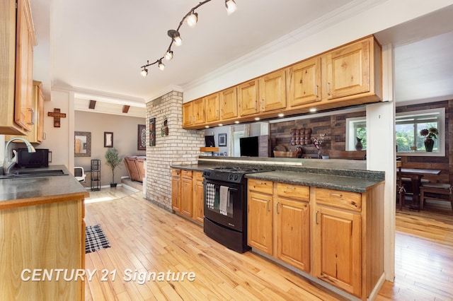 7320 N River Rd, Freeland, MI 48623 - kitchen featuring black range with gas cooktop, light wood-style floors, dark countertops, and crown molding