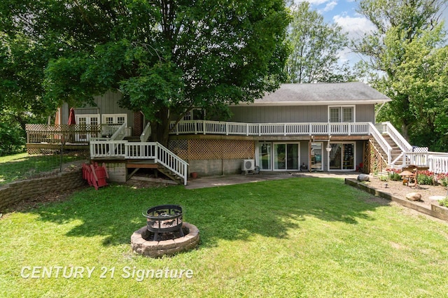 7320 N River Rd, Freeland, MI 48623 - rear view of property featuring stairs, a fire pit, and a deck