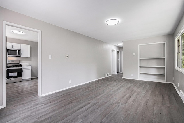 1505 Platt St, Niles, MI 49120 - unfurnished living room featuring dark wood-style floors and built in shelves