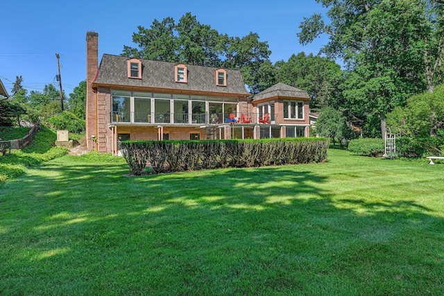1818 Greenbriar Dr, Portage, MI 49024 - back of property with brick siding, a chimney, and a yard