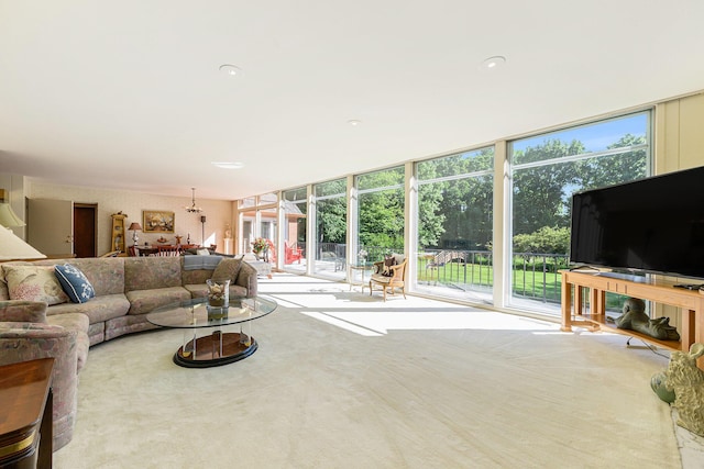1818 Greenbriar Dr, Portage, MI 49024 - living area with a chandelier and a wall of windows