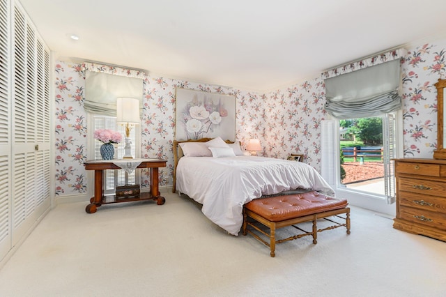 1818 Greenbriar Dr, Portage, MI 49024 - bedroom with carpet flooring, wallpapered walls, a closet, and access to outside