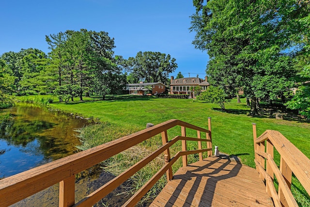 1818 Greenbriar Dr, Portage, MI 49024 - wooden deck with a water view and a lawn