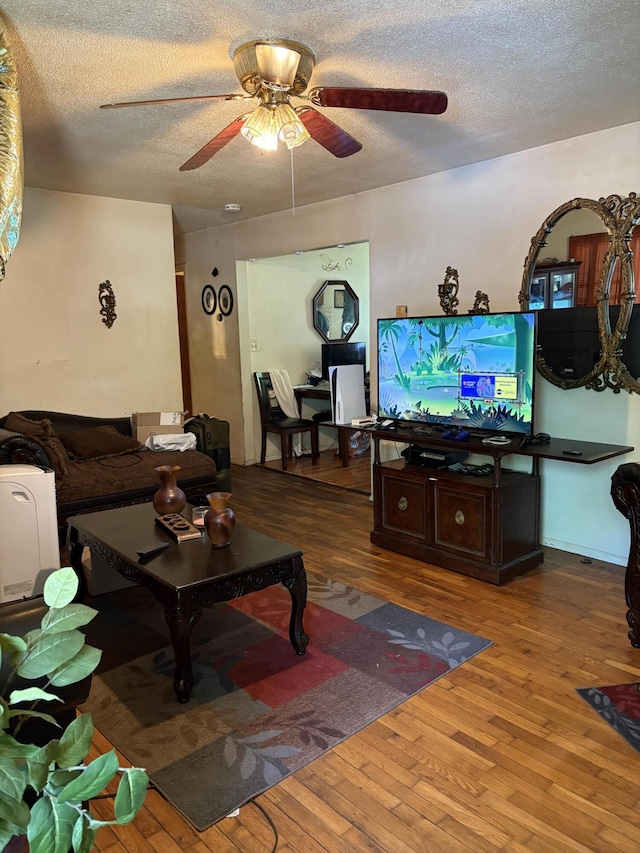 1596 Kay Dr, Benton Harbor, MI 49022 - living area featuring a ceiling fan, wood finished floors, and a textured ceiling