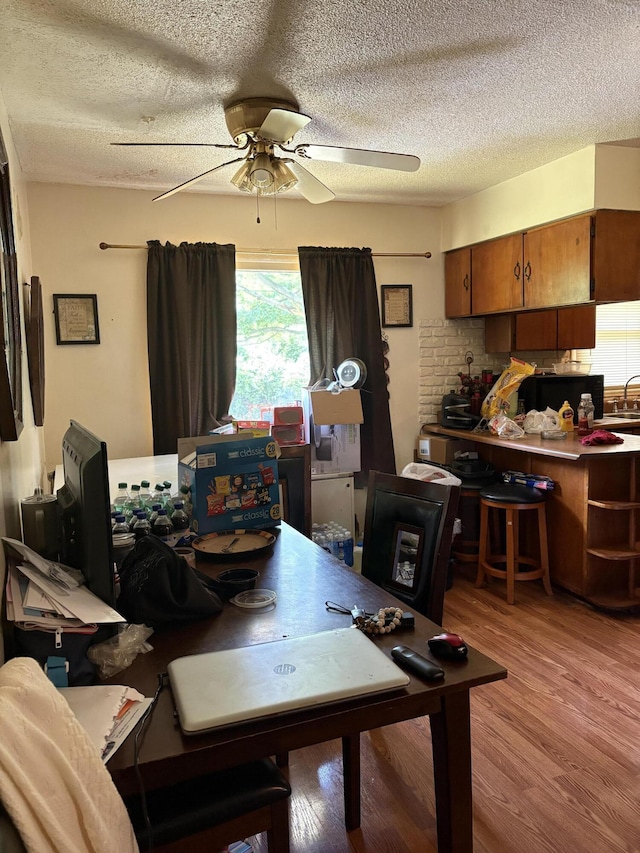 1596 Kay Dr, Benton Harbor, MI 49022 - dining space with ceiling fan, a textured ceiling, and light wood-type flooring