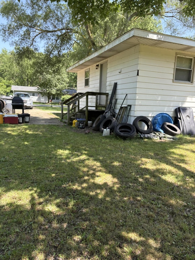 1596 Kay Dr, Benton Harbor, MI 49022 - back of property featuring a lawn
