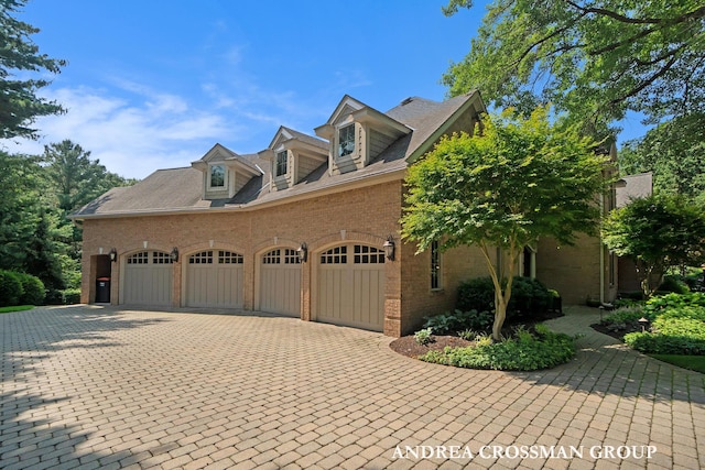 41 Bay Meadows Dr, Holland, MI 49424 - view of front of home with an attached garage, decorative driveway, and brick siding