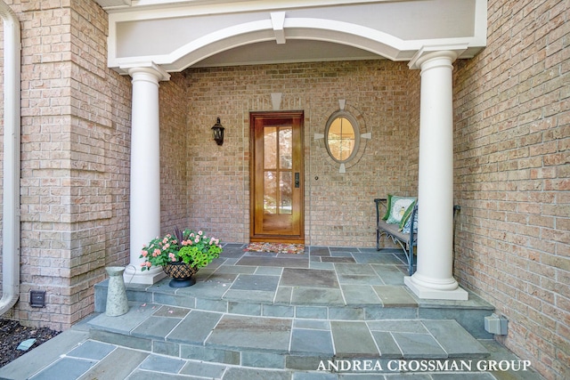 41 Bay Meadows Dr, Holland, MI 49424 - entrance to property featuring covered porch and brick siding