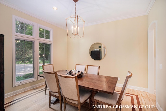 41 Bay Meadows Dr, Holland, MI 49424 - dining area with plenty of natural light, light wood finished floors, ornamental molding, and a chandelier