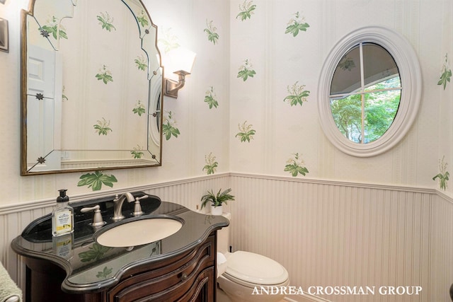41 Bay Meadows Dr, Holland, MI 49424 - bathroom featuring a wainscoted wall, vanity, and wallpapered walls