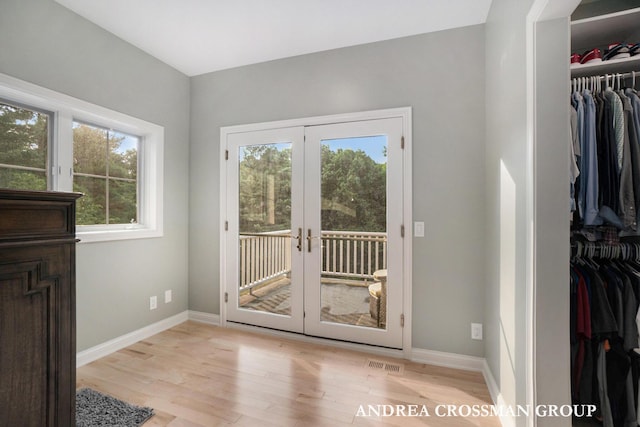 41 Bay Meadows Dr, Holland, MI 49424 - doorway to outside featuring light wood-style flooring and french doors