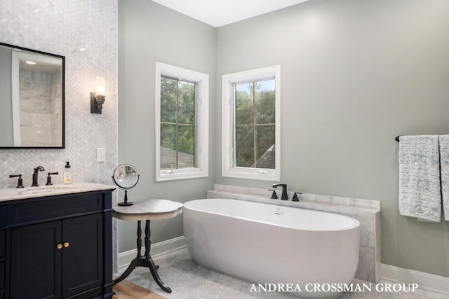 41 Bay Meadows Dr, Holland, MI 49424 - full bathroom featuring a soaking tub and vanity