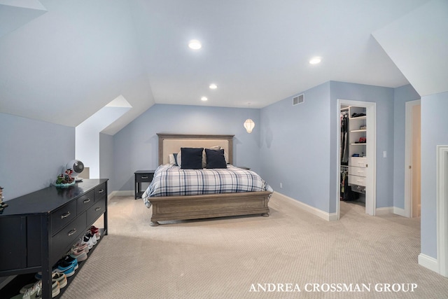 41 Bay Meadows Dr, Holland, MI 49424 - bedroom featuring light colored carpet, a walk in closet, vaulted ceiling, recessed lighting, and a closet