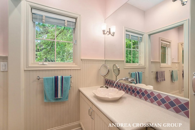 41 Bay Meadows Dr, Holland, MI 49424 - bathroom with healthy amount of natural light, vanity, and a wainscoted wall