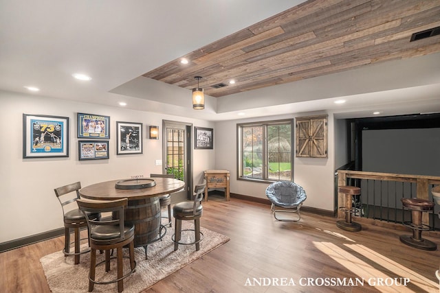 41 Bay Meadows Dr, Holland, MI 49424 - dining area featuring a raised ceiling, wood finished floors, recessed lighting, and wood ceiling