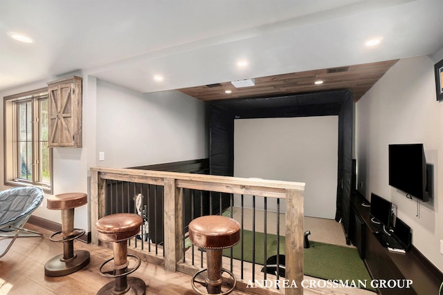 41 Bay Meadows Dr, Holland, MI 49424 - cinema room featuring a bar, recessed lighting, and wood finished floors