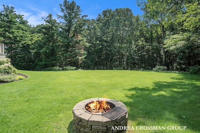 41 Bay Meadows Dr, Holland, MI 49424 - view of grassy yard with an outdoor fire pit