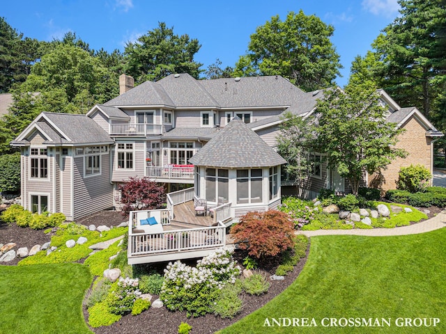 41 Bay Meadows Dr, Holland, MI 49424 - rear view of property featuring a sunroom, a chimney, a deck, and a lawn