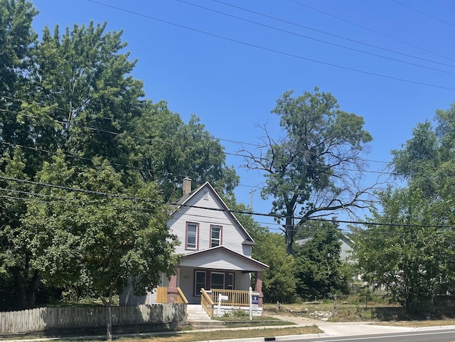 515 Hall St SE, Grand Rapids, MI 49507 - view of front of property featuring a porch and a chimney