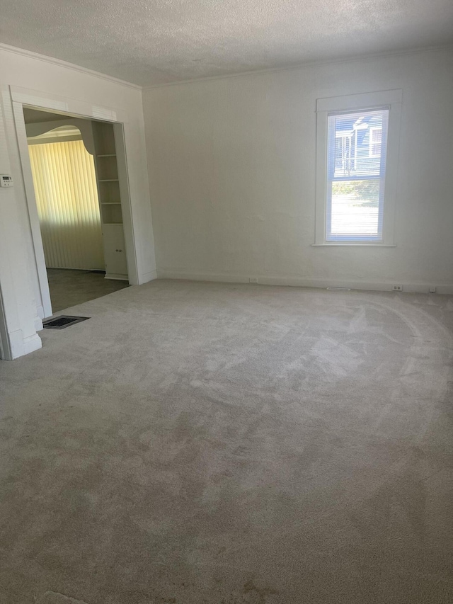 515 Hall St SE, Grand Rapids, MI 49507 - empty room with carpet floors and a textured ceiling