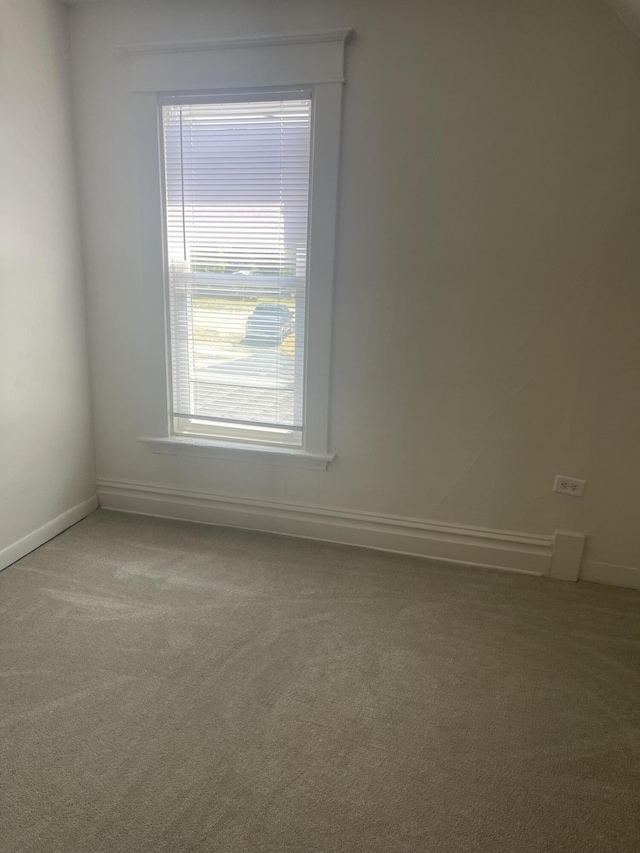 515 Hall St SE, Grand Rapids, MI 49507 - unfurnished room featuring light colored carpet and baseboards