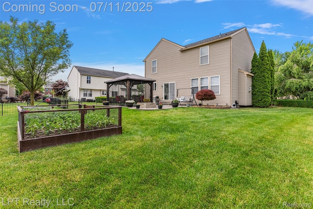 17952 Marsal Dr, Macomb, MI 48042 - rear view of property featuring a gazebo, a garden, and a patio