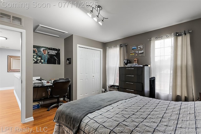 17952 Marsal Dr, Macomb, MI 48042 - bedroom with attic access, wood finished floors, a closet, and an office area