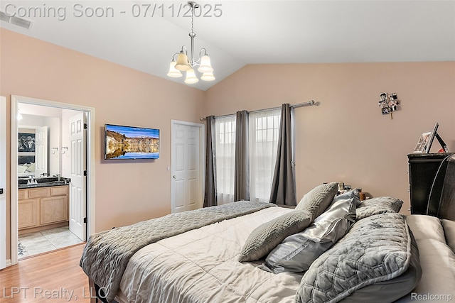 17952 Marsal Dr, Macomb, MI 48042 - bedroom featuring a chandelier, lofted ceiling, light wood finished floors, and ensuite bathroom