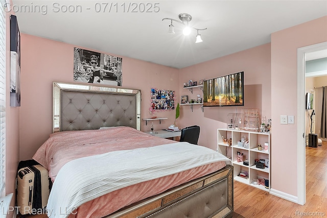 17952 Marsal Dr, Macomb, MI 48042 - bedroom featuring wood finished floors and track lighting