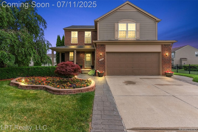 17952 Marsal Dr, Macomb, MI 48042 - traditional home with brick siding, a garage, and driveway