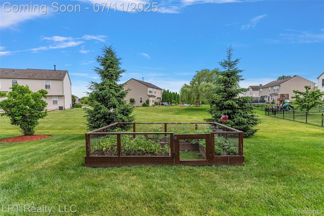 17952 Marsal Dr, Macomb, MI 48042 - view of yard featuring a garden and a residential view