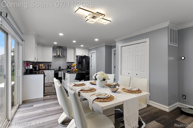17952 Marsal Dr, Macomb, MI 48042 - dining room featuring light wood finished floors, recessed lighting, and ornamental molding