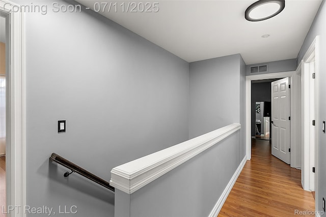 17952 Marsal Dr, Macomb, MI 48042 - corridor featuring an upstairs landing and light wood-style flooring