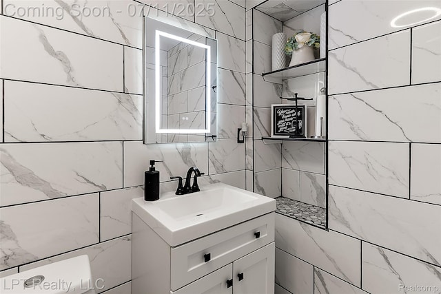 17952 Marsal Dr, Macomb, MI 48042 - bathroom featuring vanity, a tile shower, and tile walls