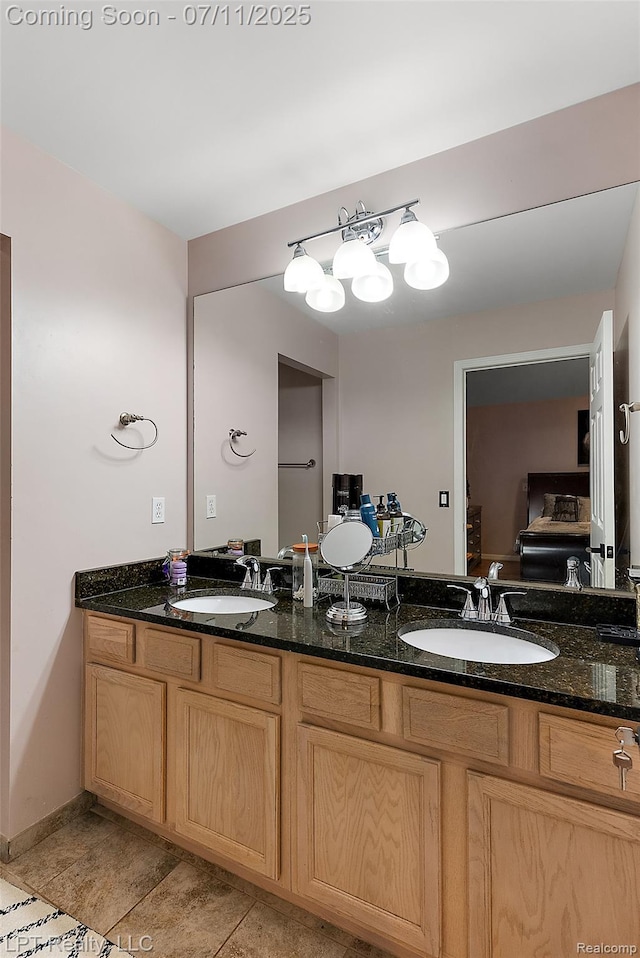 17952 Marsal Dr, Macomb, MI 48042 - full bathroom featuring double vanity and tile patterned floors