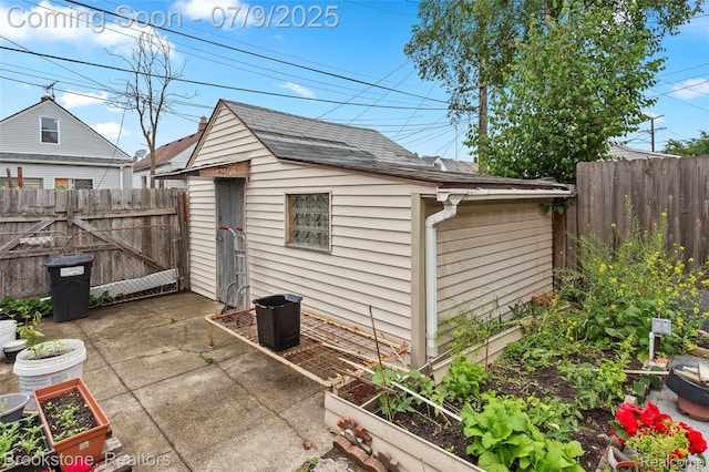 3831 Casmere St, Hamtramck, MI 48212 - view of outdoor structure with a garden and a gate